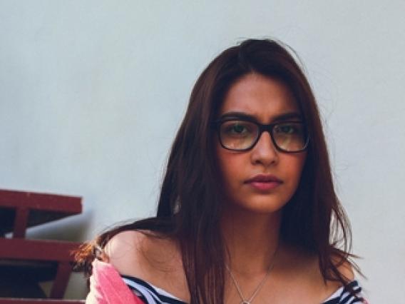 young woman with glasses portrait