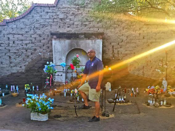 Jesus Jaime-Diaz standing in front of Tucson's El Tiradito Wishing Shrine