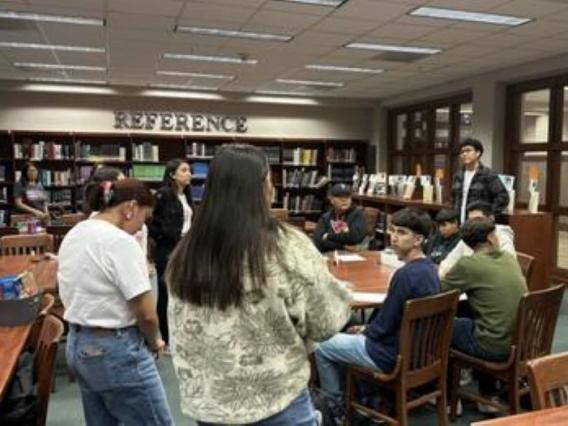 group of students and educators gathered in a library