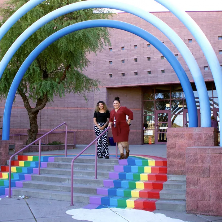 educators standing on school steps
